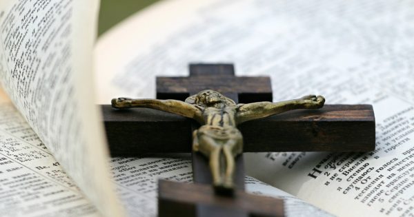 Crucifix On Top Of Bible