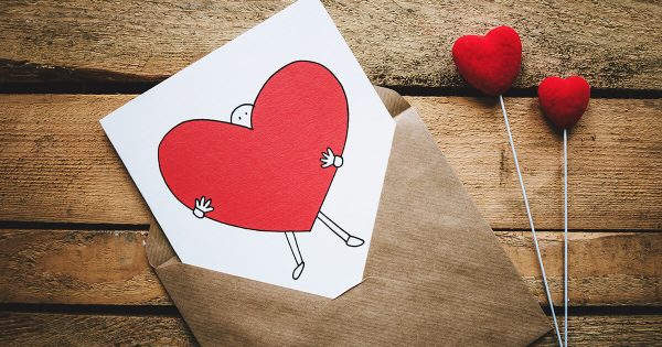 Valentine Card with Person Holding Giant Heart